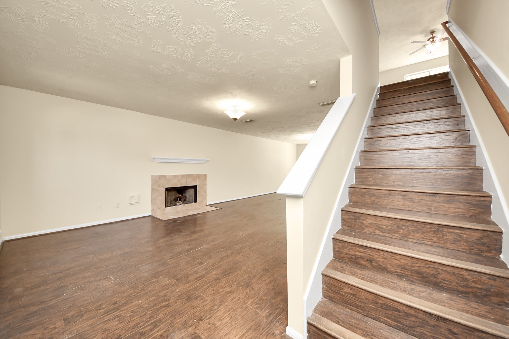 Stairs leading to bedrooms, flex space and laundry area.