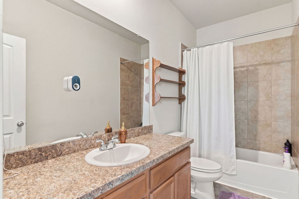 Upstairs full bath tub/shower.