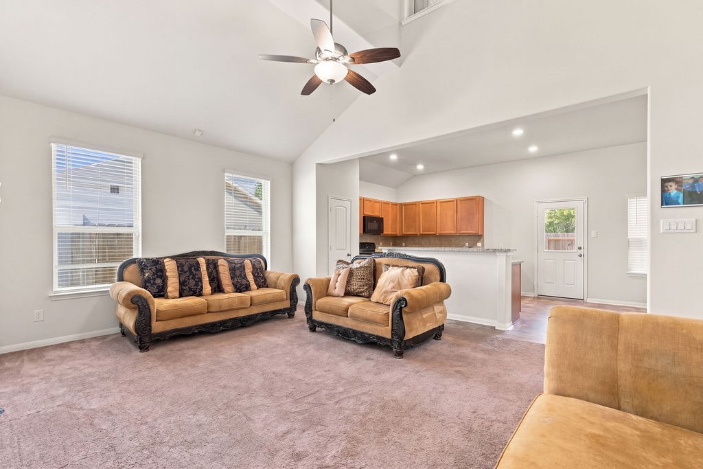 Open airy living area/kitchen and dining room. Room modified.