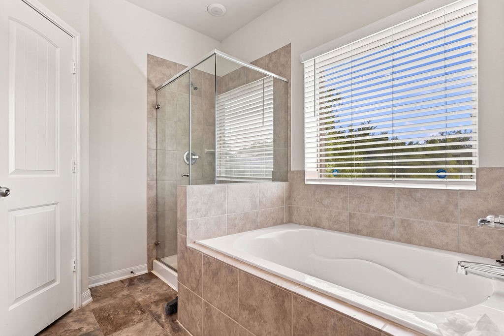 Primary shower and tub.
