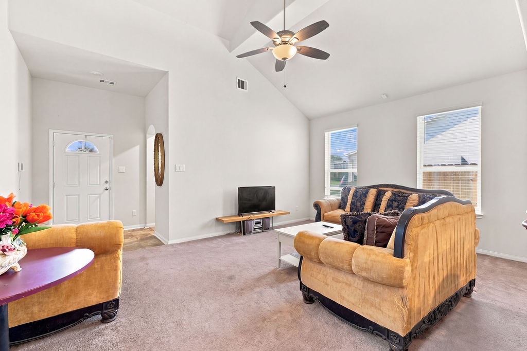 Another look of the living area with large windows and lots of natural light.