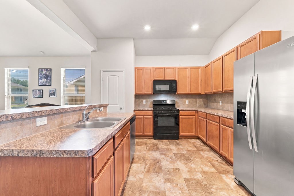 Open concept kitchen area with plenty of cabinet space.