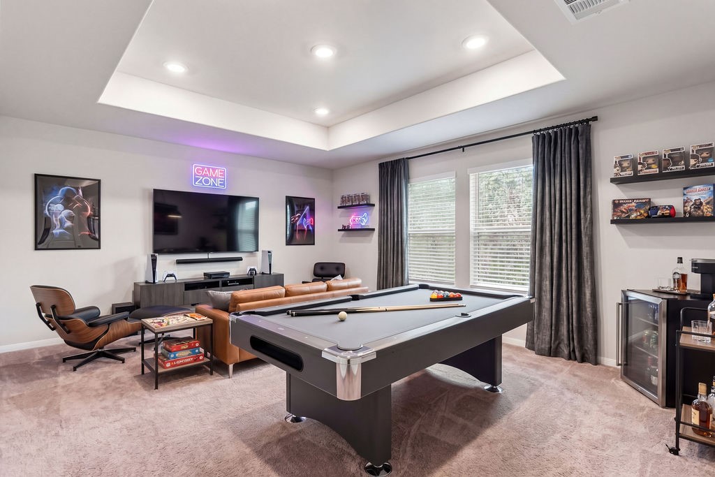 A virtual staged look of the game room upstairs. Possible game/movie night room.
