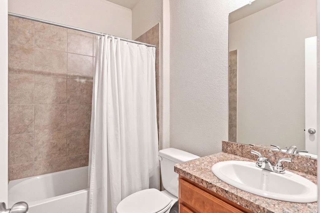 Downstairs full bathroom with tub and shower.