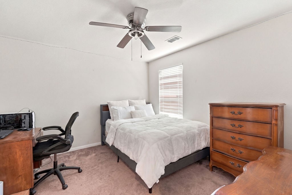 Fourth bedroom upstairs (virtually staged).