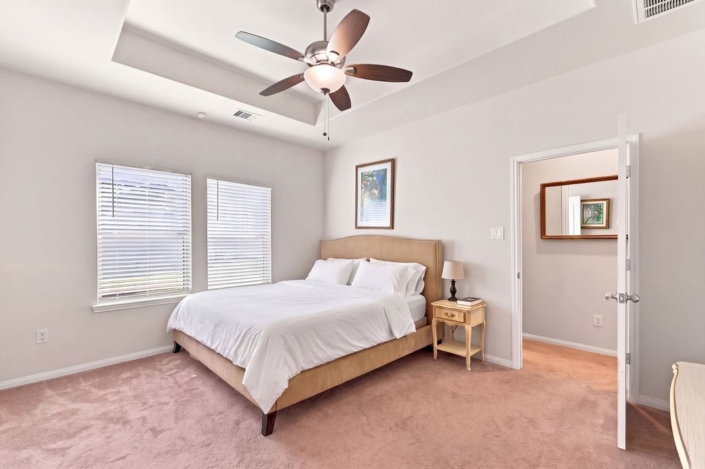Great look in the primary room with large windows. Virtually staged.