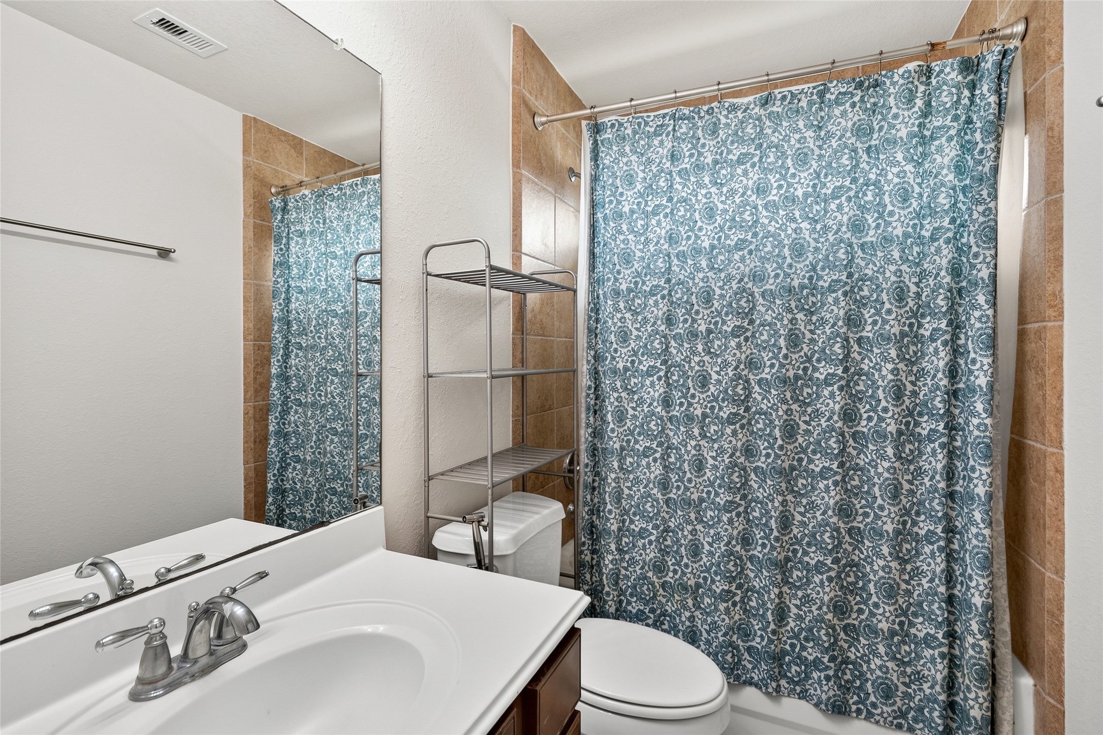 Your upstairs full bath features a convenient tub and shower combination, providing comfort and functionality for everyday living.