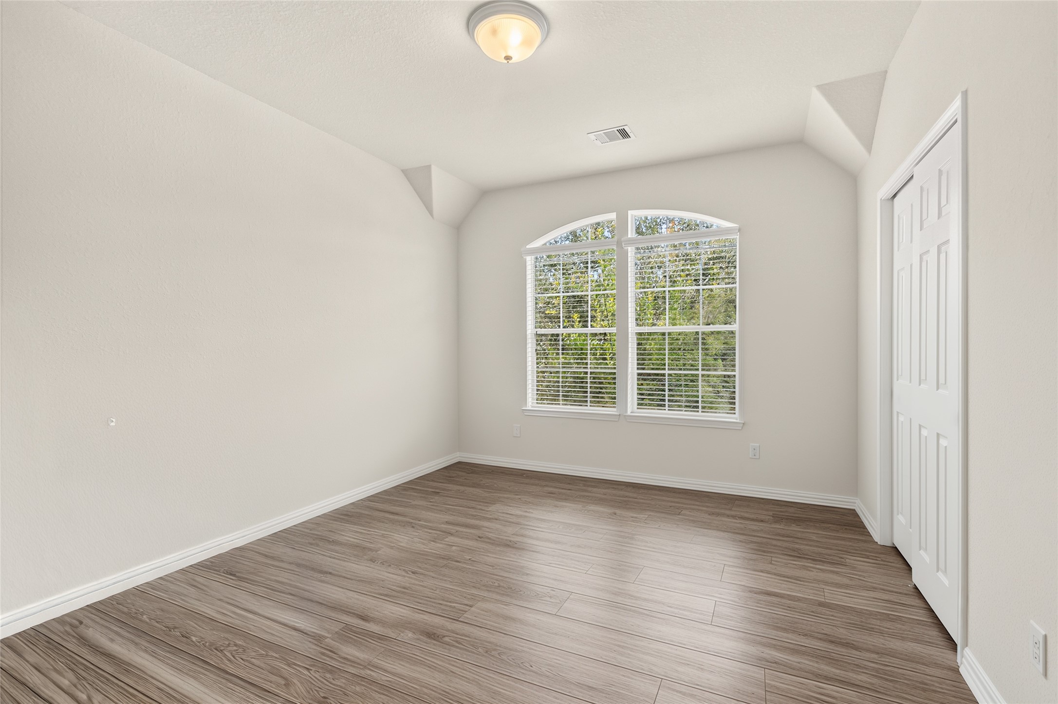 This versatile secondary bedroom offers plenty of space for family, guests, or a comfortable home office tailored to your lifestyle.