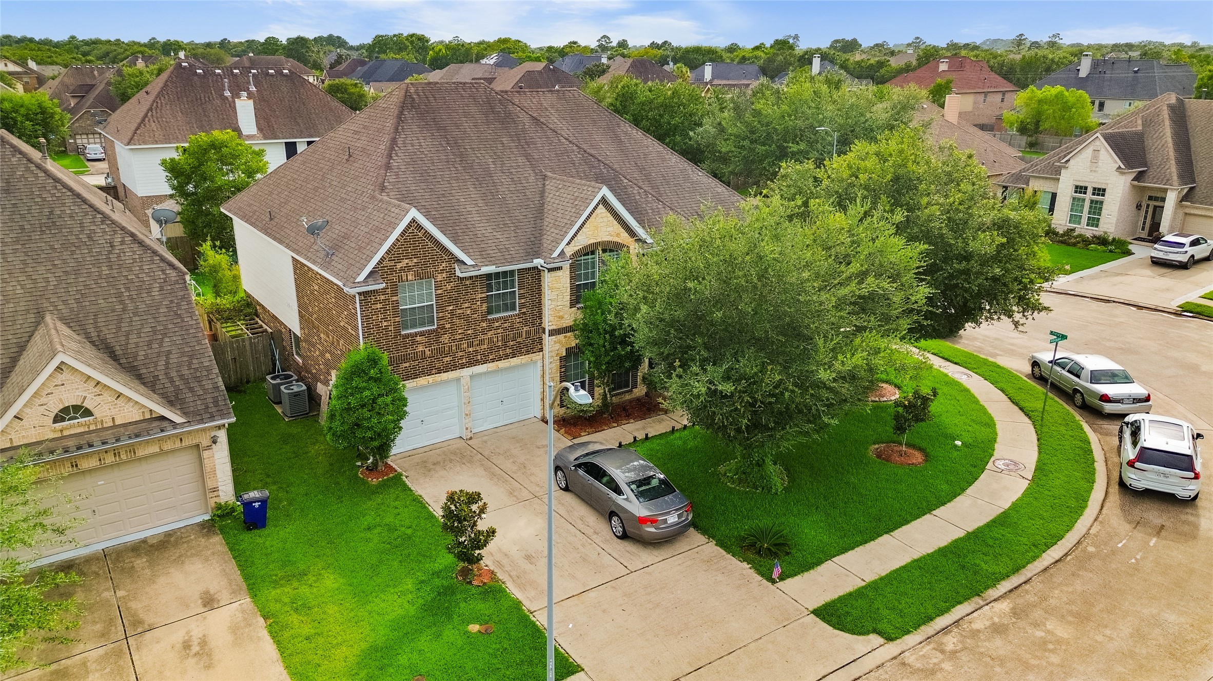 Pulling into the driveway each day, you're welcomed by lush landscaping and a home that stands out on its spacious lot.
