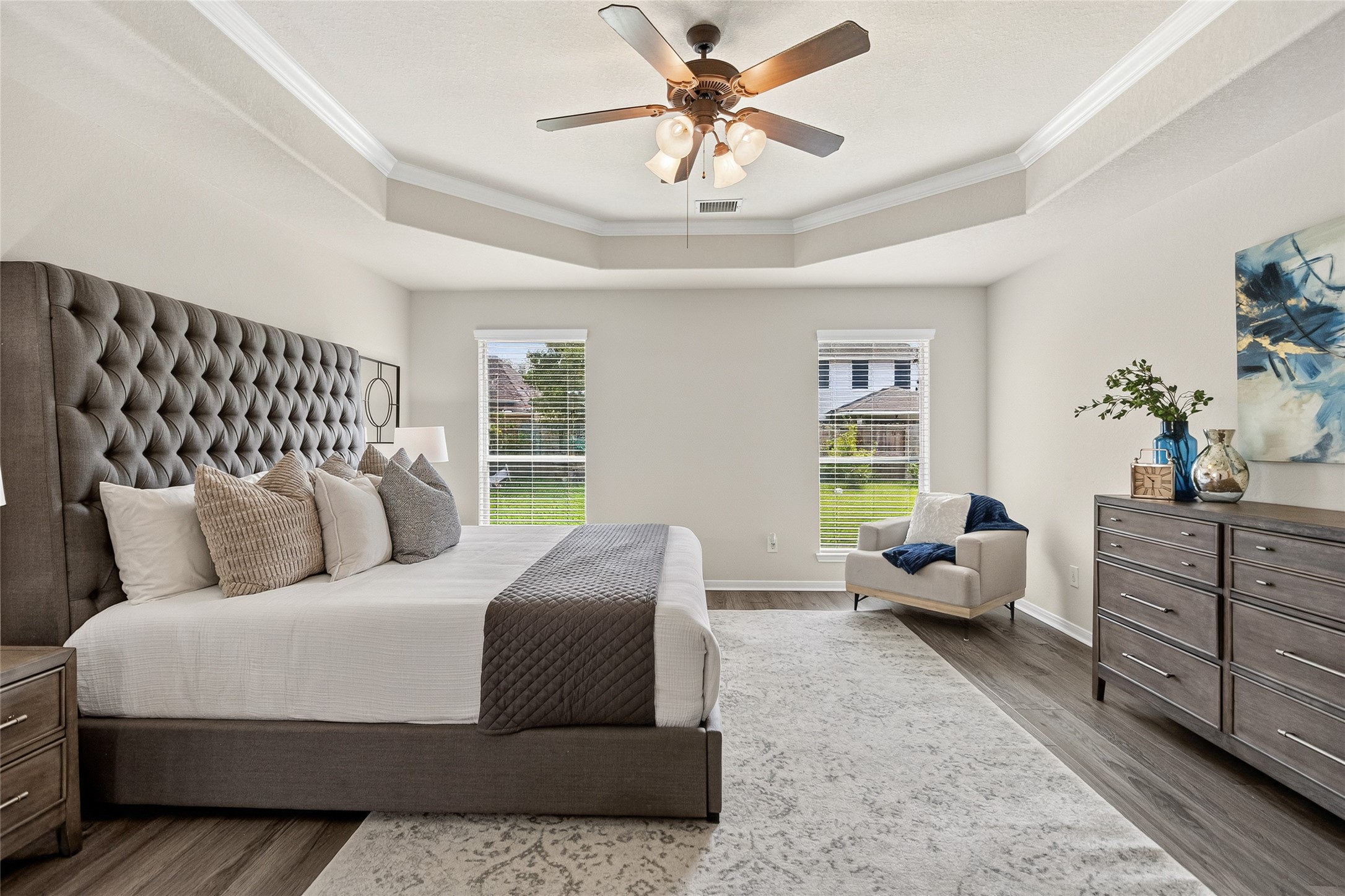 Waking up feels refreshing in the oversized primary bedroom, where large windows, elegant finishes, and abundant space create a true owner's retreat.