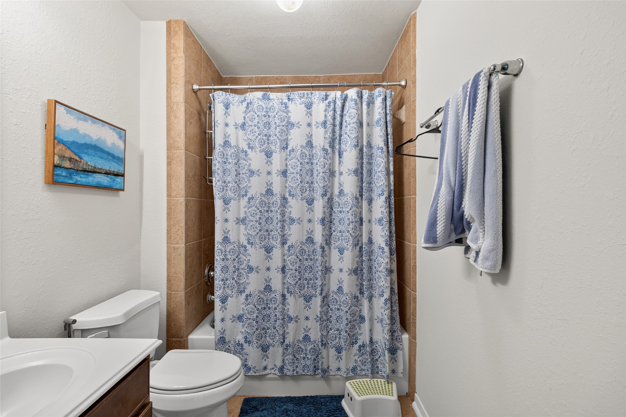 Your full upstairs bath offers a convenient layout with a tiled tub and shower combination, making busy mornings and guest stays a breeze.