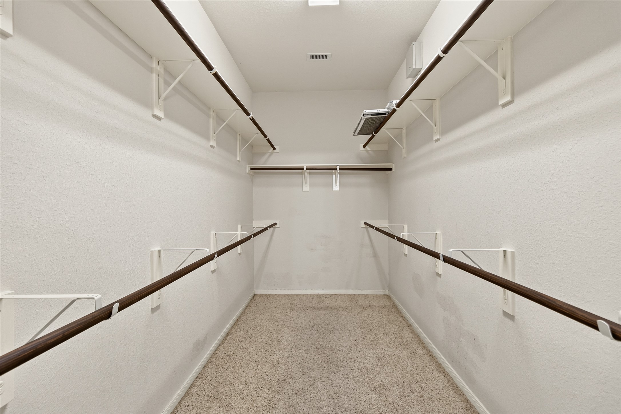 Your oversized walk-in closet provides exceptional storage with abundant hanging space to keep every season and wardrobe organized.