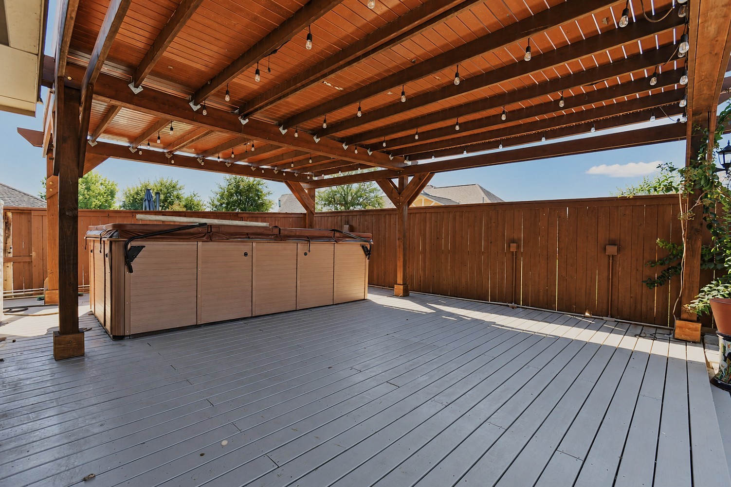 Covered deck patio swim hot tub.