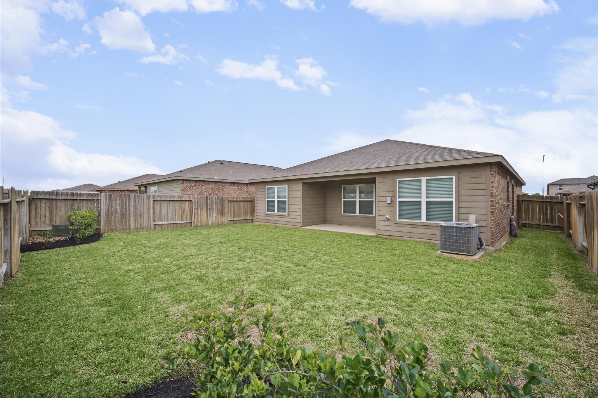 Nice covered patio and easy maintenance back yard.