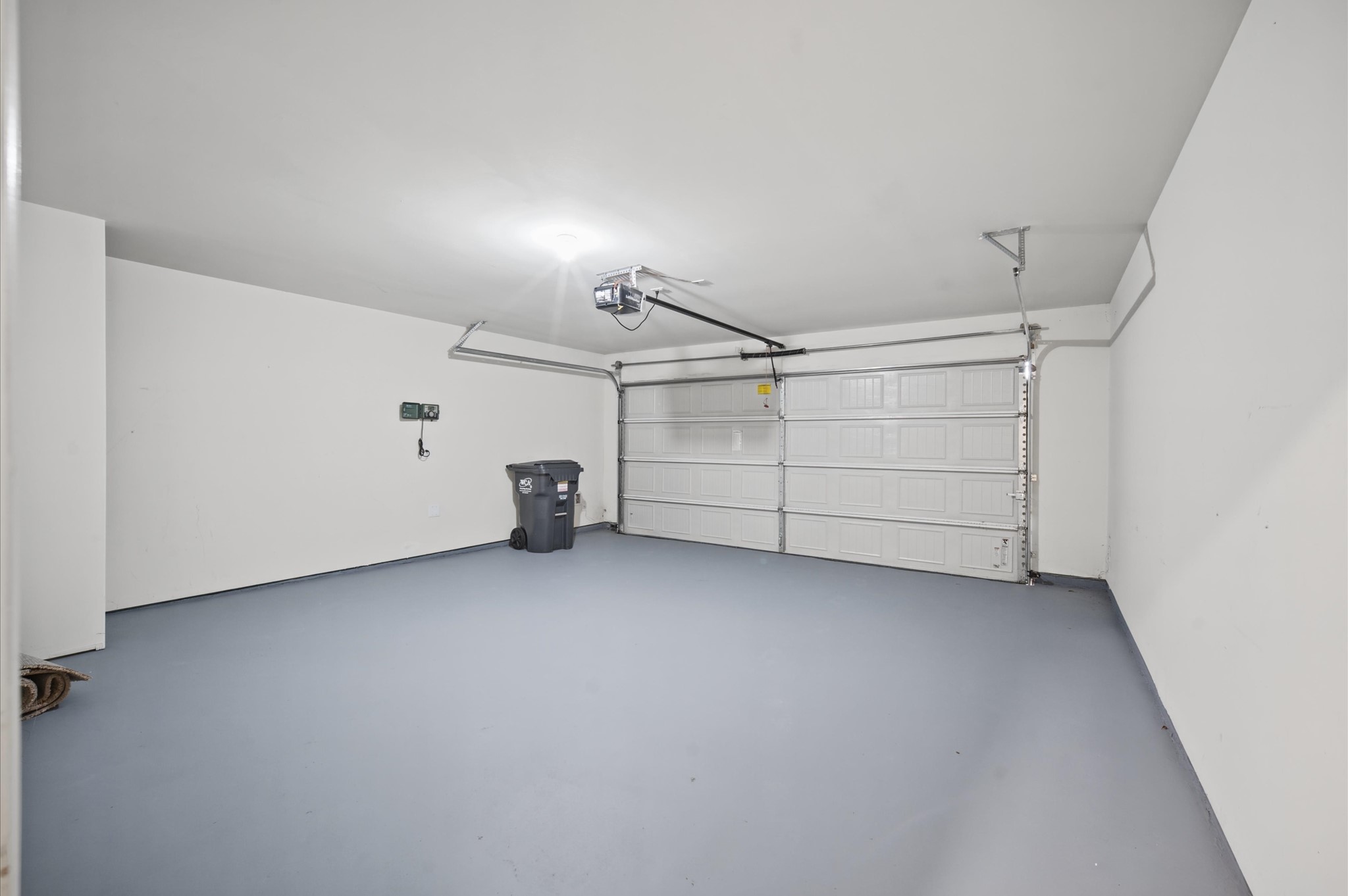 Freshly painted garage floor and walls. Garage door opener inlcuded.