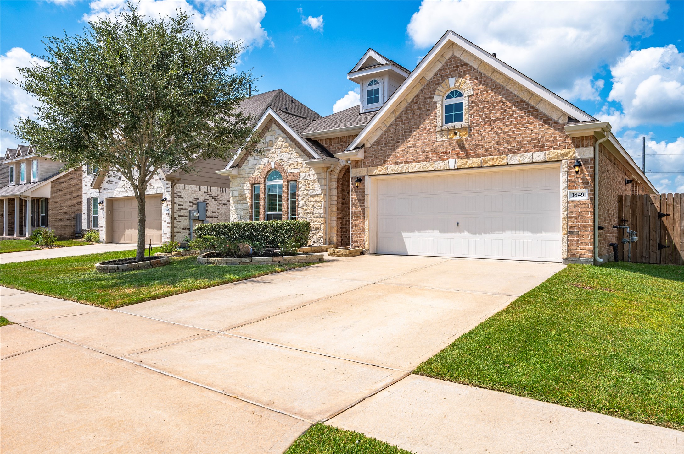 Charming brick and stone exterior with a spacious two-car garage, nestled in a well-maintained neighborhood.  No MUD Taxes and a low HOA make this home a very affordable option.