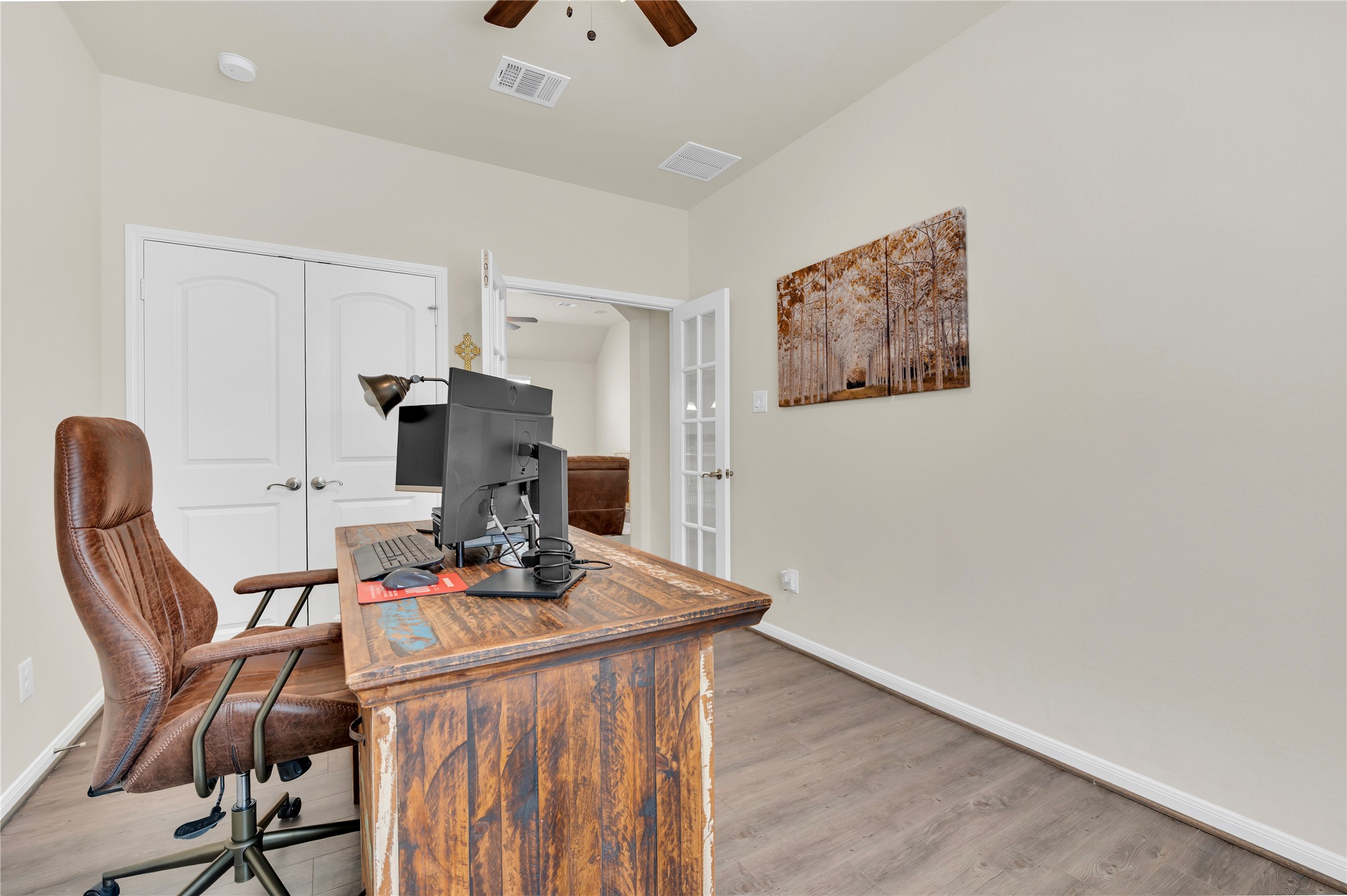 Inviting home office, 4th bedroom, or play area.  The french doors add additional privacy.