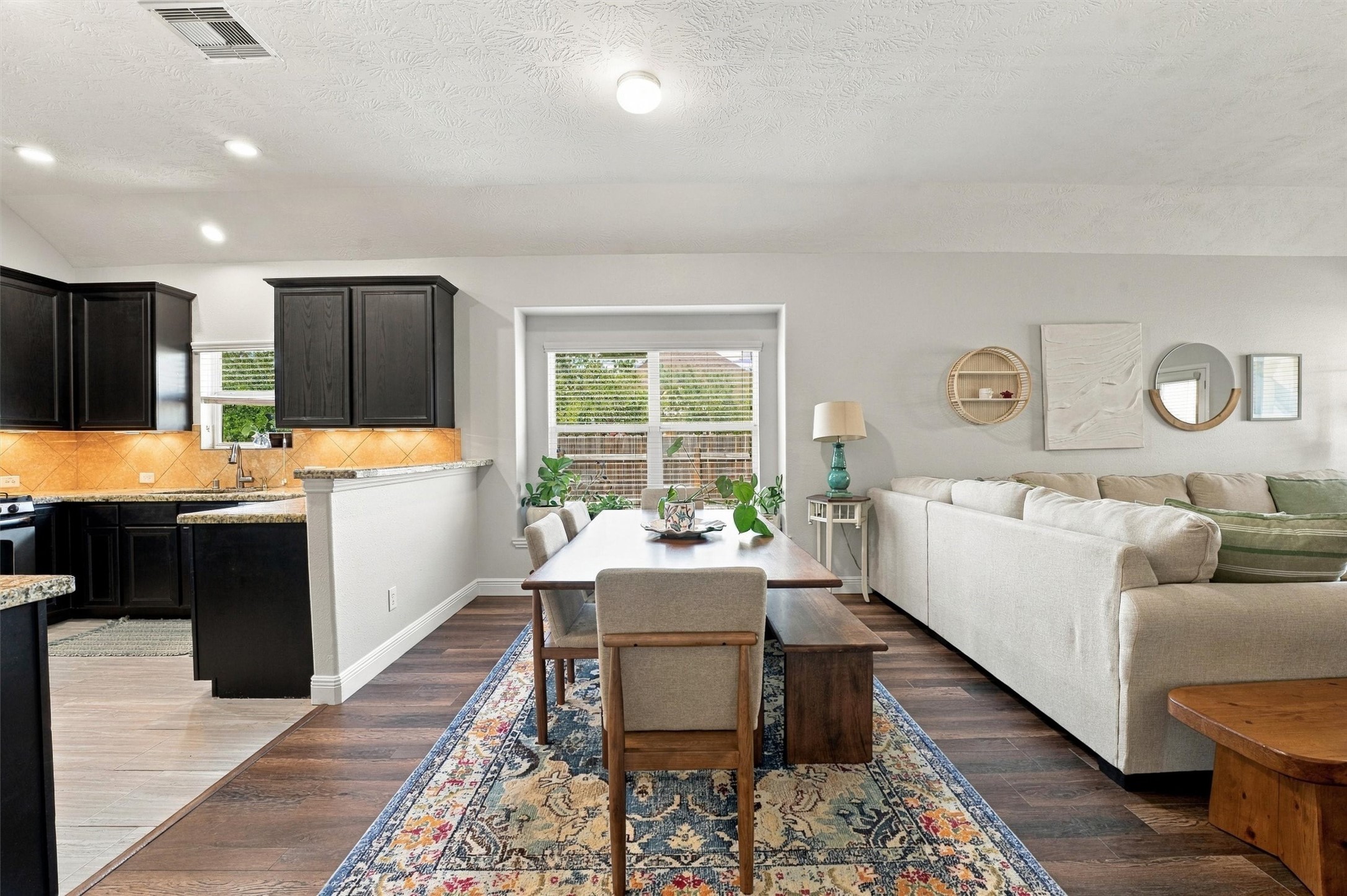 Open-concept kitchen overlooks the spacious living area, ideal for everyday living and entertaining.