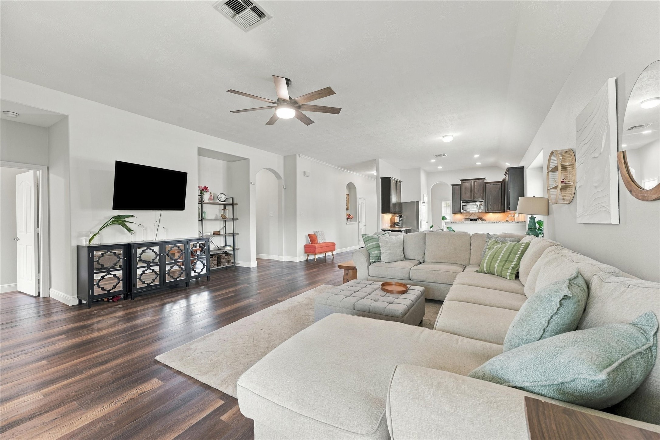 Light-filled living area flows seamlessly into the kitchen and breakfast nook.