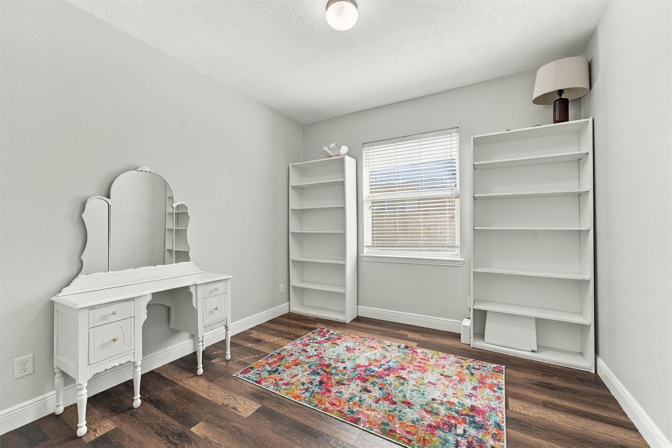 Flexible office or game room with french doors.