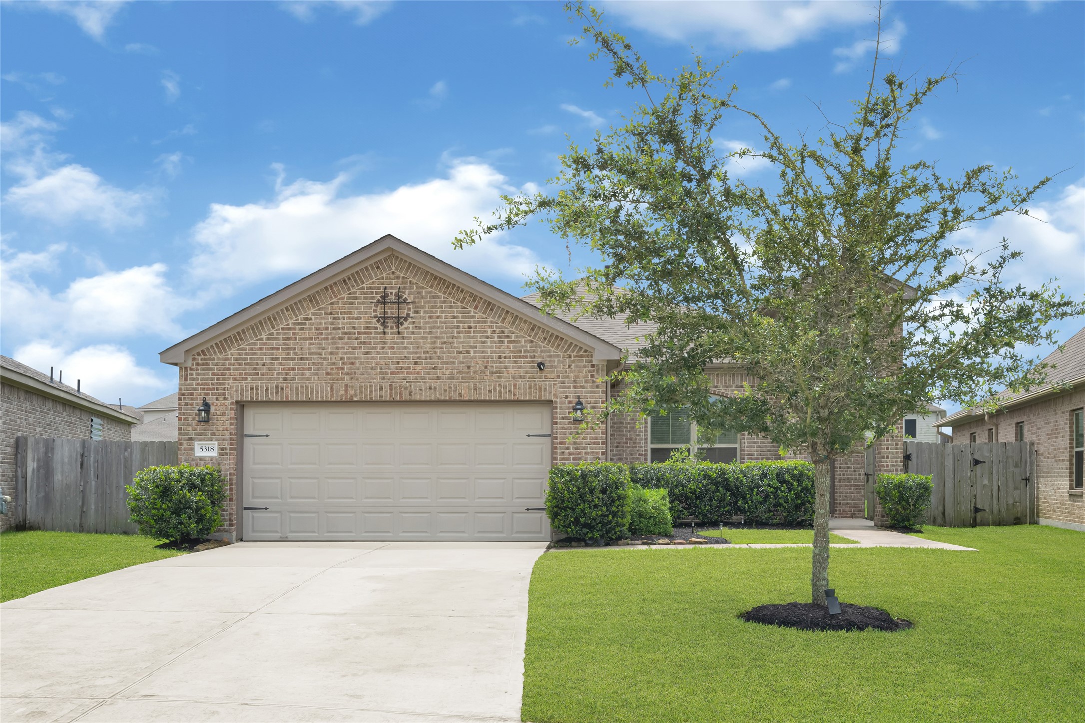 Charming single-story home situated on a spacious lot with a welcoming front entry.