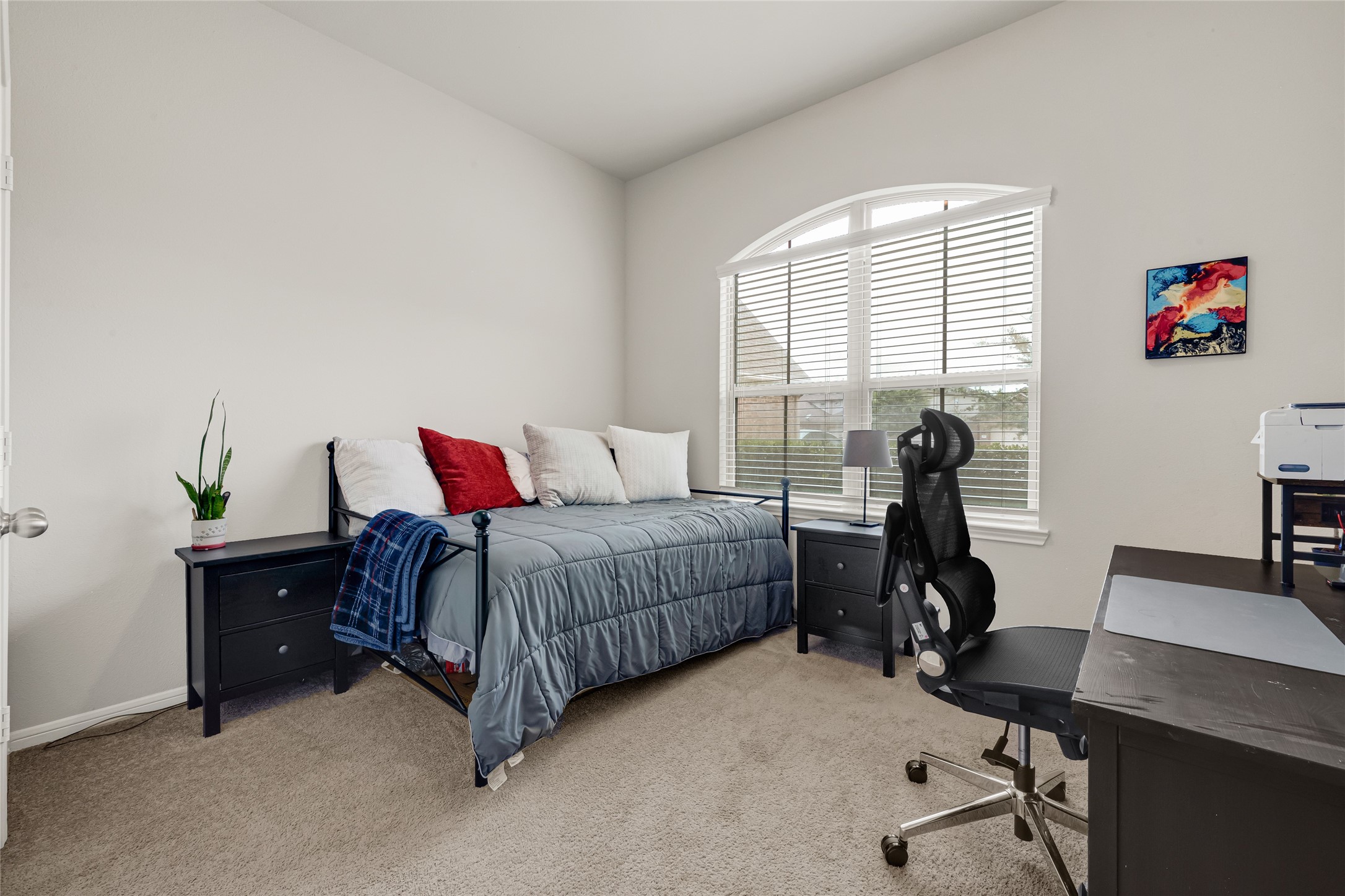 Comfortable secondary bedroom with excellent natural light.