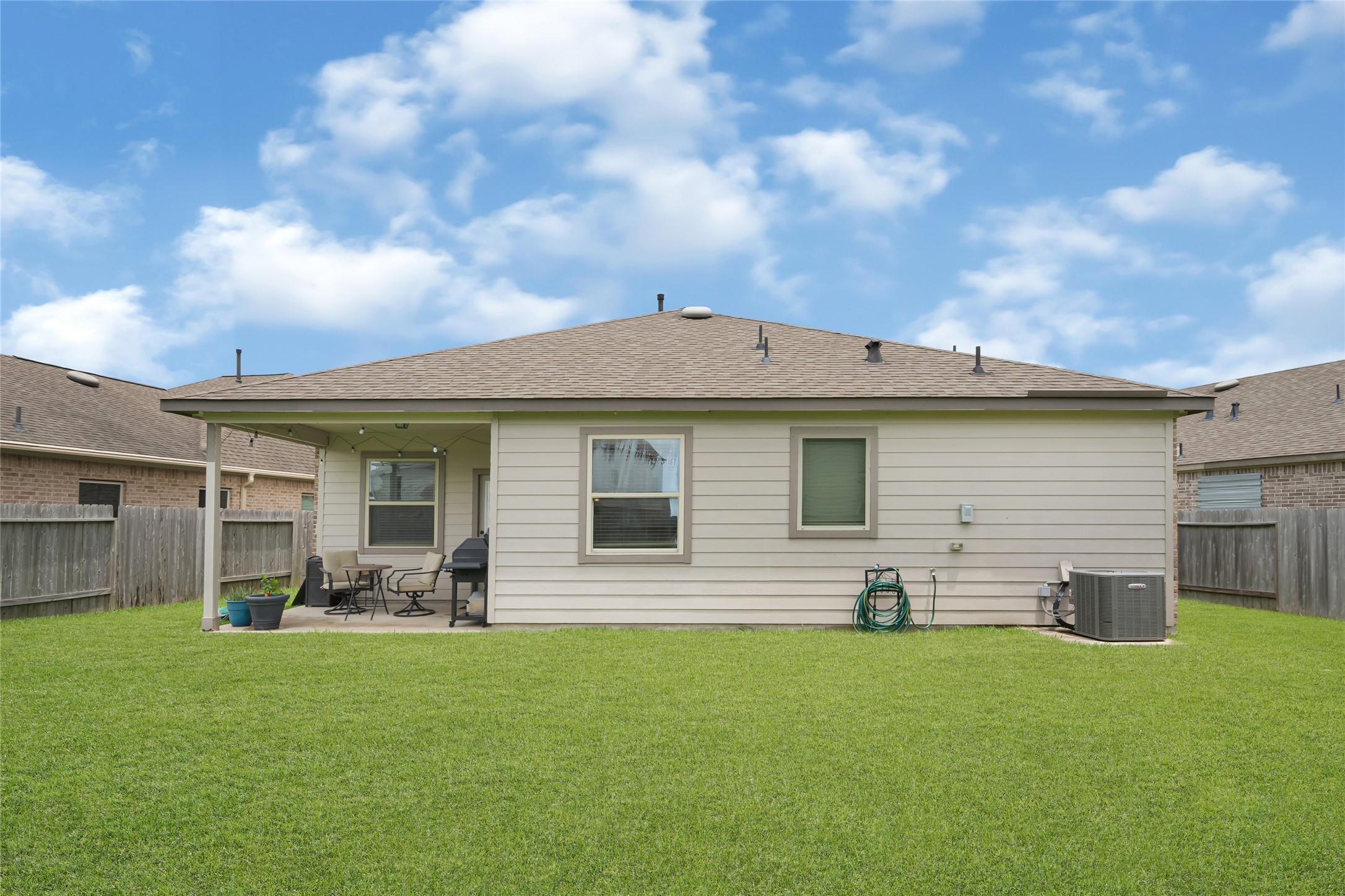 Covered patio creates the perfect space for relaxing or entertaining year-round.