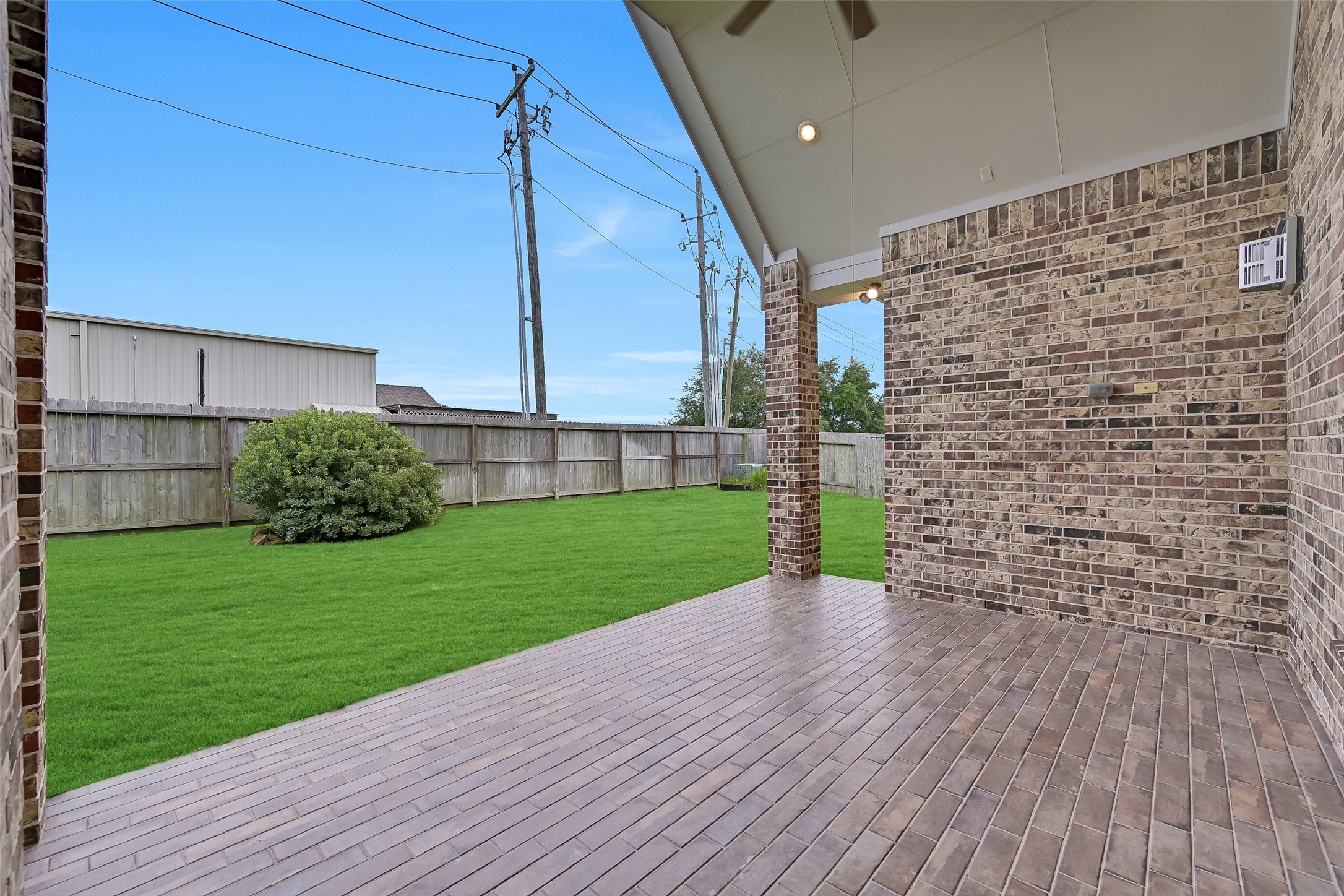 Step outside to a spacious covered patio designed for year-round enjoyment. The vaulted ceiling, ceiling fan, recessed lighting, and generous footprint provide the perfect setting for outdoor dining, grilling, or relaxing with friends while overlooking the expansive backyard. With plenty of room to add an outdoor kitchen, this space is ready to become your favorite gathering spot.