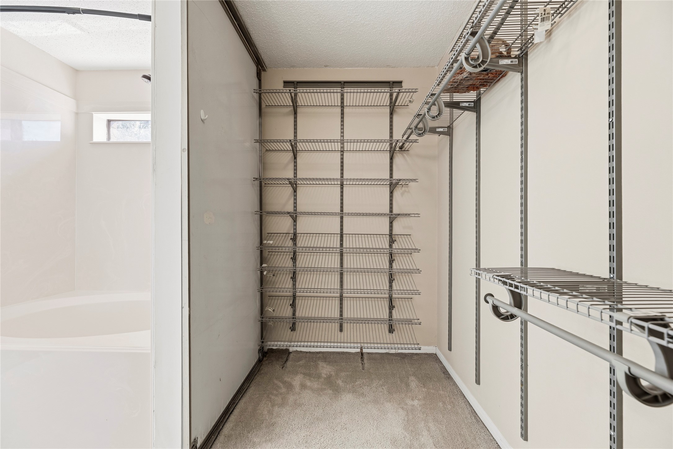 Primary walk-in closet.