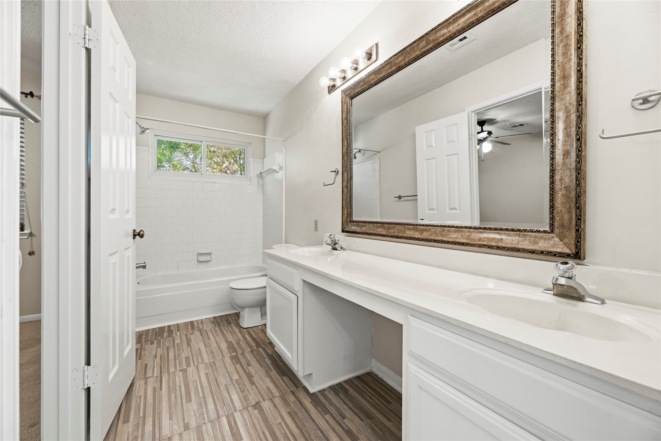 Upstairs full bathroom shared by the secondary bedrooms.
