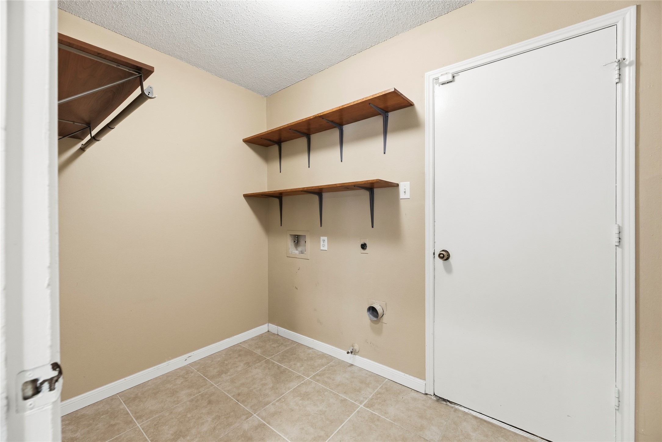 Utility room with storage shelving.