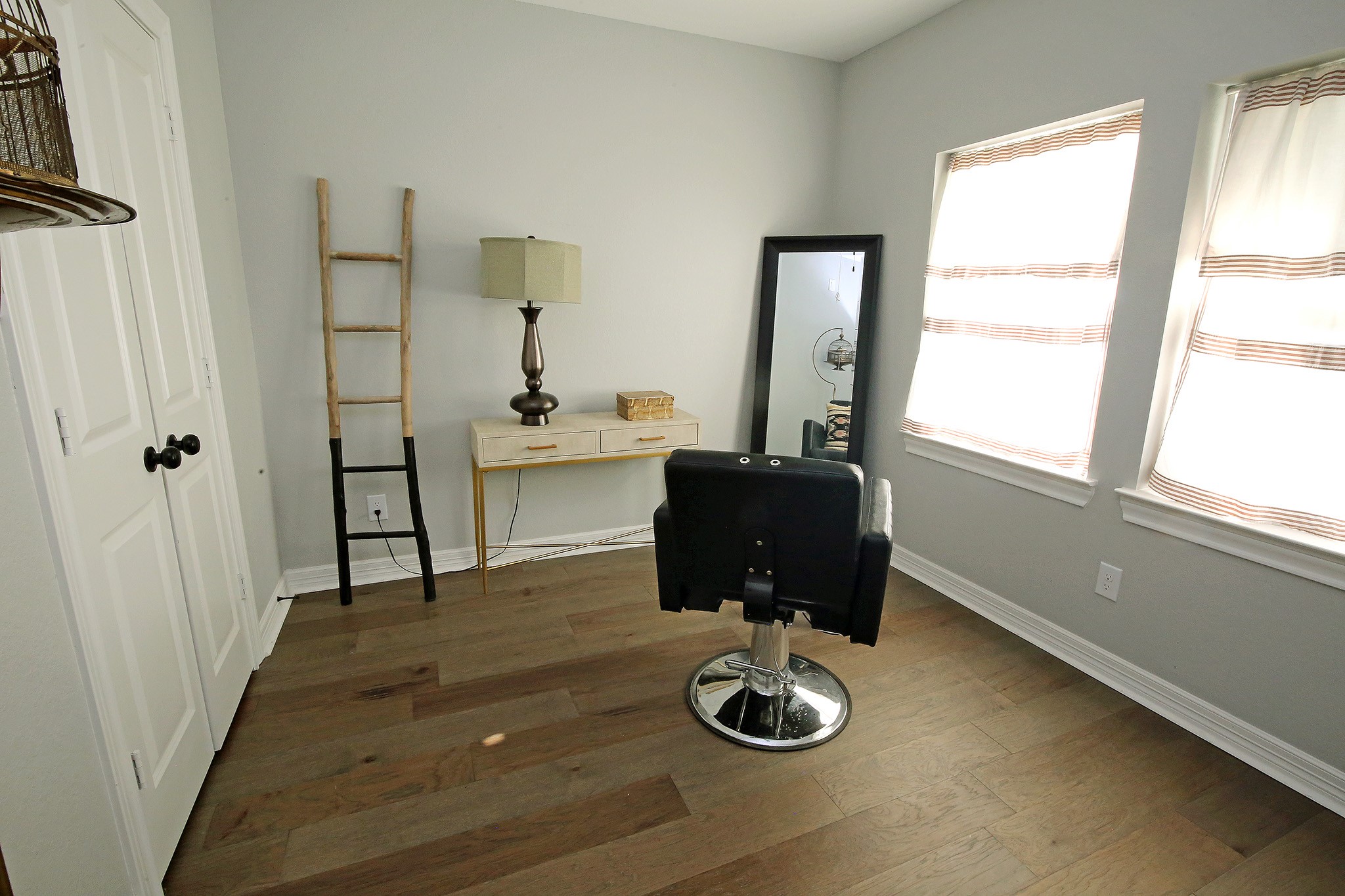 Bedroom #1 with natural lighting from the windows.