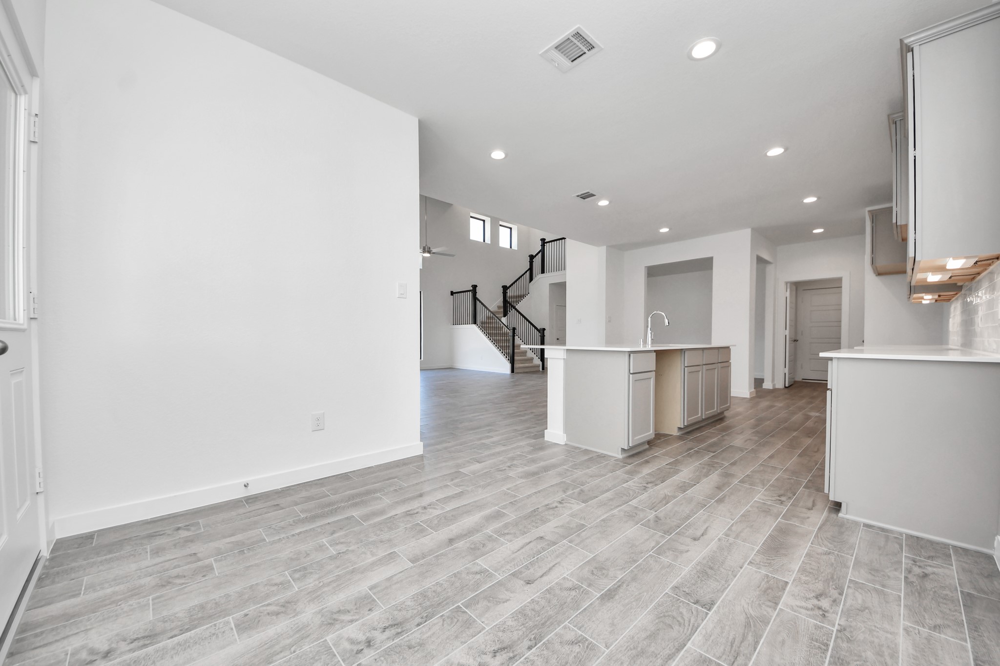 Enjoy breakfast with ease in the connected and cozy breakfast area, seamlessly integrated with the kitchen for utmost convenience. Step through the back door for a breath of fresh air onto the covered patio, extending your living space to the outdoors