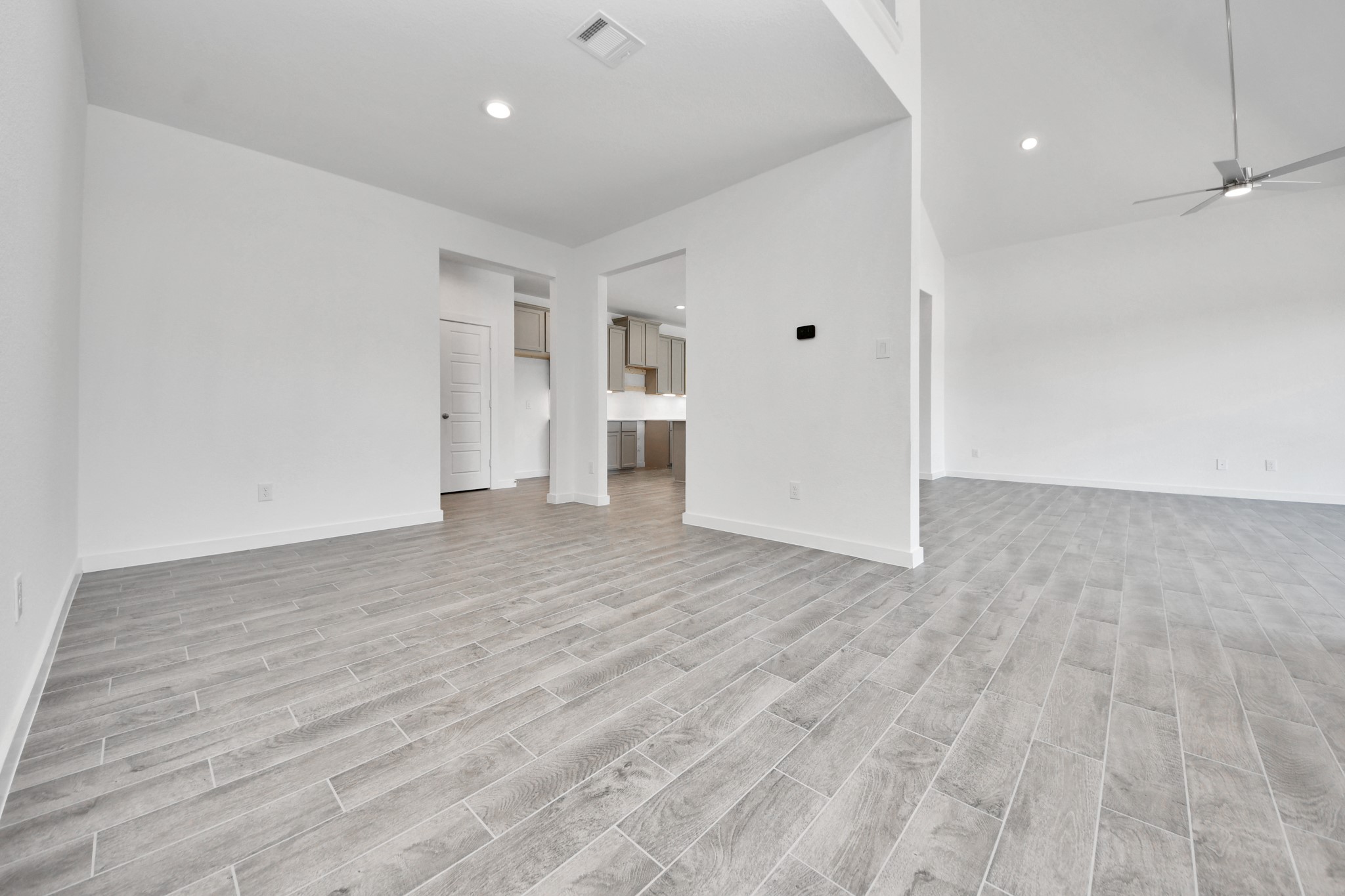 Make memories gathered around the table with your family and friends! This spacious dining room features elegant flooring, custom paint, and adjacent to family room and kitchen for open concept feel.