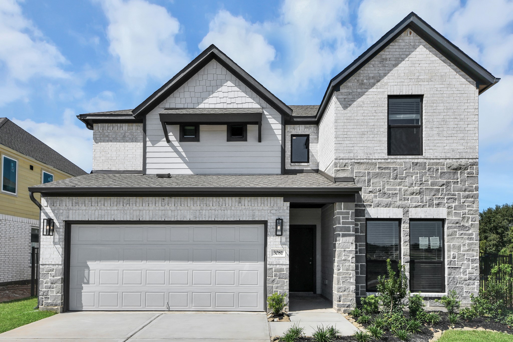 The residence features a practical 2-car garage complemented by a generous driveway, ensuring abundant space for parking needs. The residence features a practical 2-car garage complemented by a generous driveway, ensuring abundant space for parking needs.