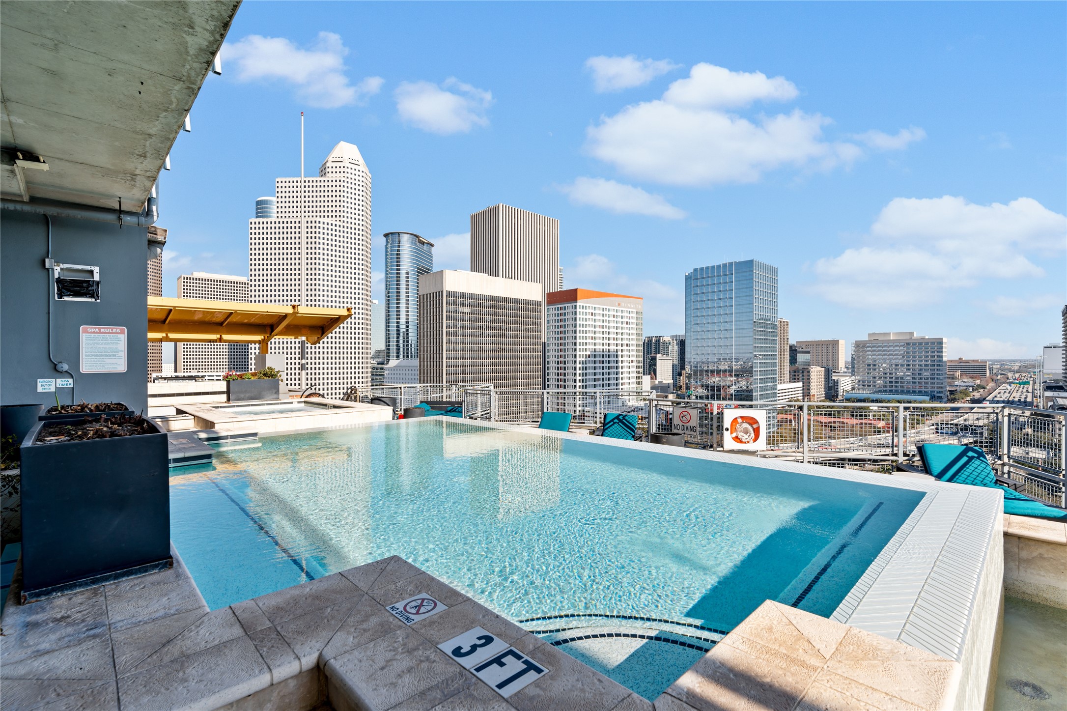 The rooftop pool offers sweeping views of the Downtown Houston skyline, creating a resort style retreat above the energy of the city.