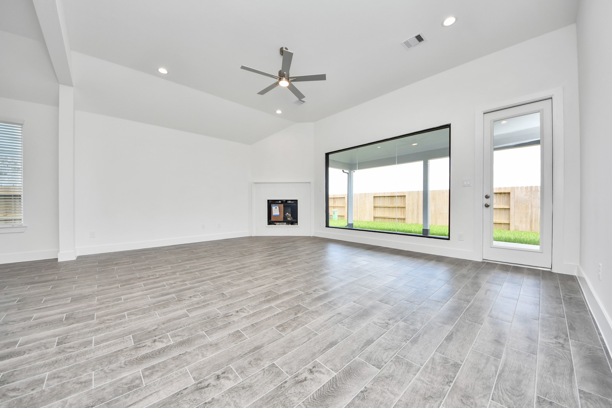 Take another glimpse into the heart of the home with this additional view of the family rooma sprawling space ready to accommodate all your gatherings. Sample photo of completed home with similar floor plan. Actual colors and selections may vary.