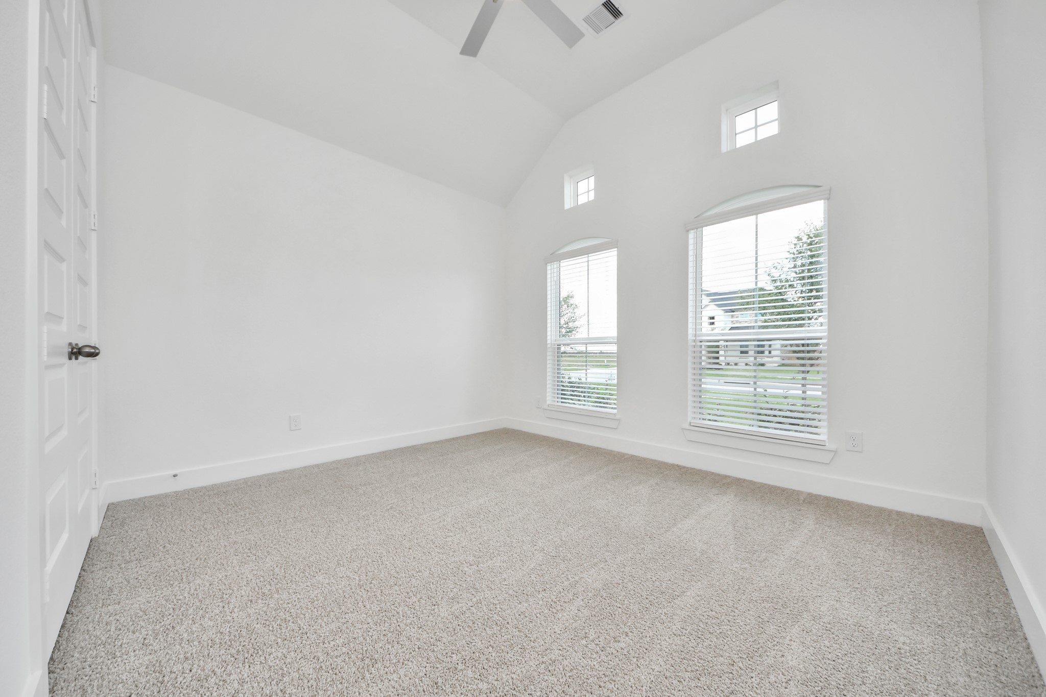 Generously sized secondary bedrooms featuring spacious closets, soft and inviting carpeting underfoot, large windows allowing plenty of natural light, and the added touch of privacy blinds for your personal retreat. Sample photo of completed home with similar floor plan. Actual colors and selections may vary.