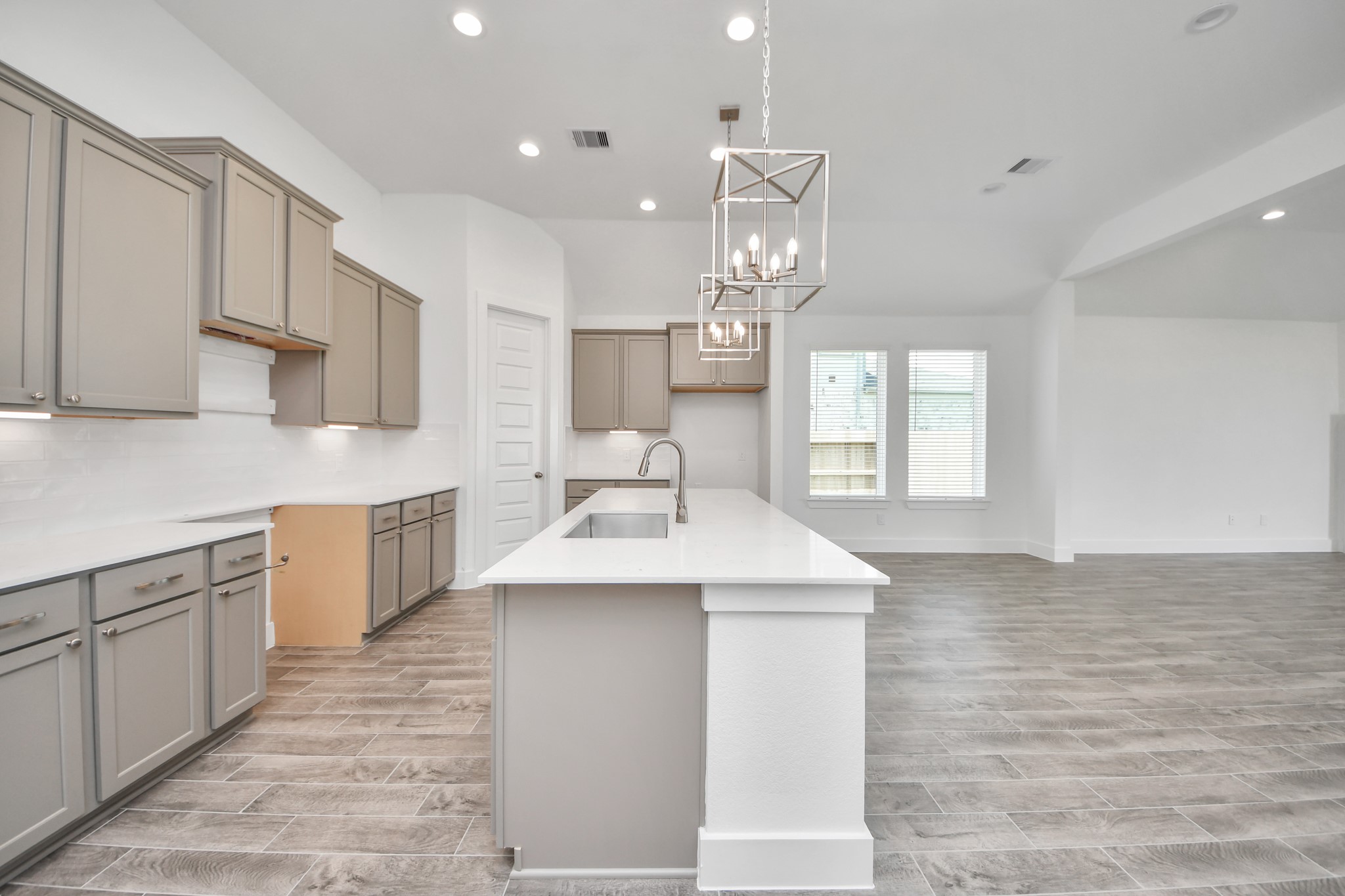 The extended counter area adds both practicality and style, making meal preparation a breeze. Every detail is thoughtfully designed to enhance the kitchen's functionality and aesthetic appeal. Sample photo of completed home with similar floor plan. Actual colors and selections may vary. The extended counter area adds both practicality and style, making meal preparation a breeze. Every detail is thoughtfully designed to enhance the kitchen's functionality and aesthetic appeal. Sample photo of completed home with similar floor plan. Actual colors and selections may vary.