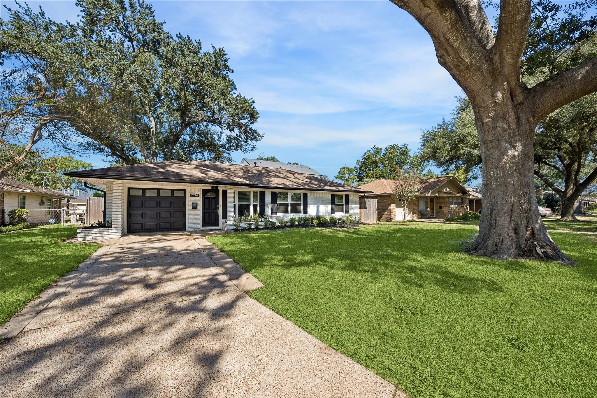 Mature trees, a welcoming front lawn, and classic Shepherd Forest character complete the picture.