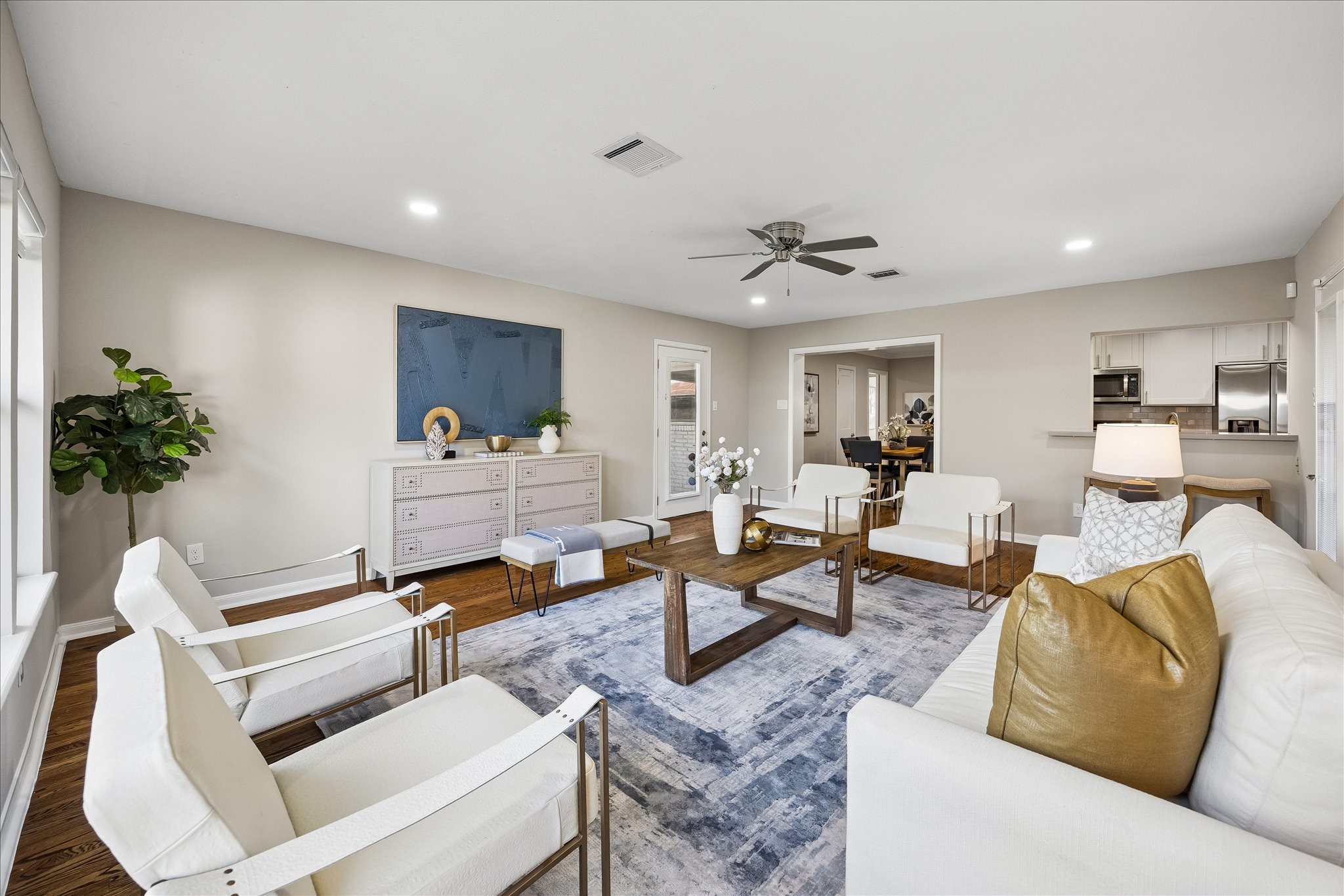 Generous proportions, warm hardwood floors, and seamless flow make this room the heart of the home.