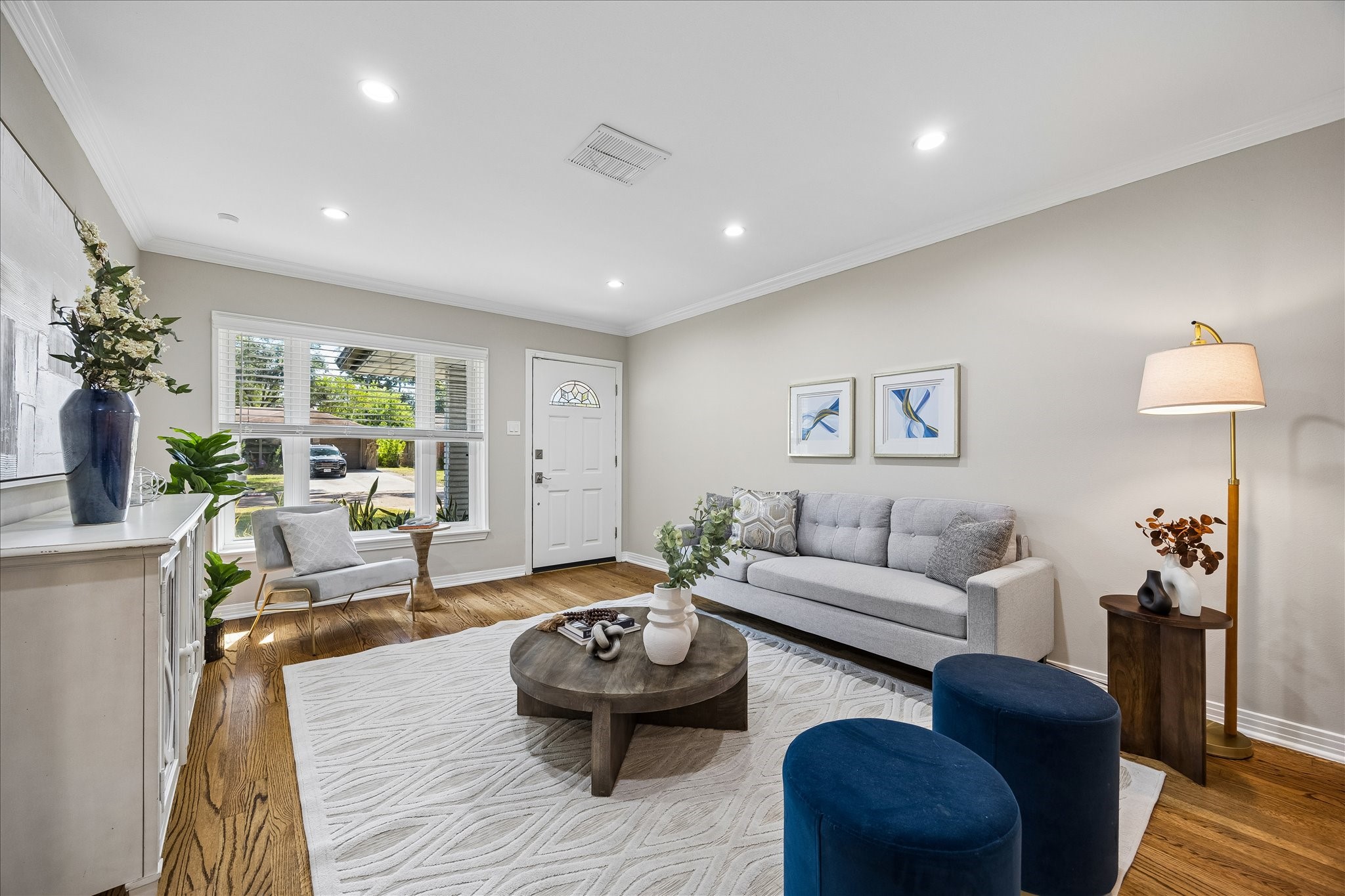 Light-filled living spaces, rich hardwood floors, and refined finishes set an inviting tone.