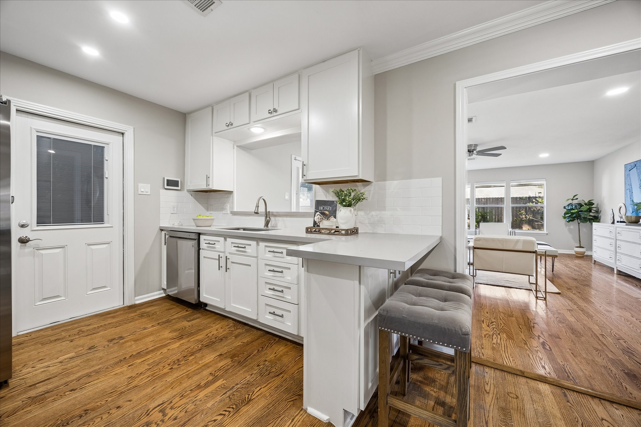 A thoughtfully designed kitchen with generous cabinetry, breakfast seating, and stylish details.