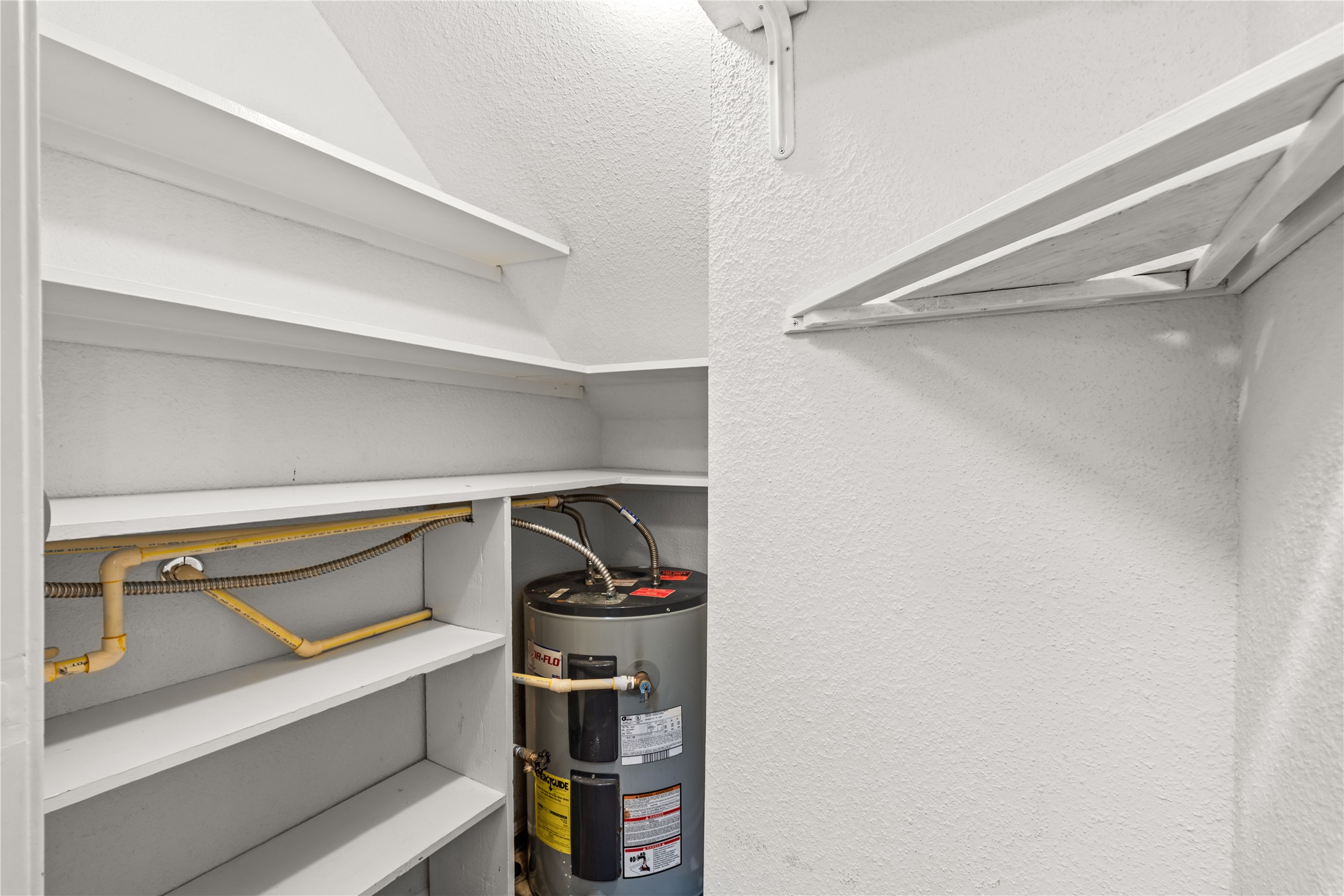 Dedicated pantry shelving provides generous storage to keep everyday essentials organized and within easy reach.