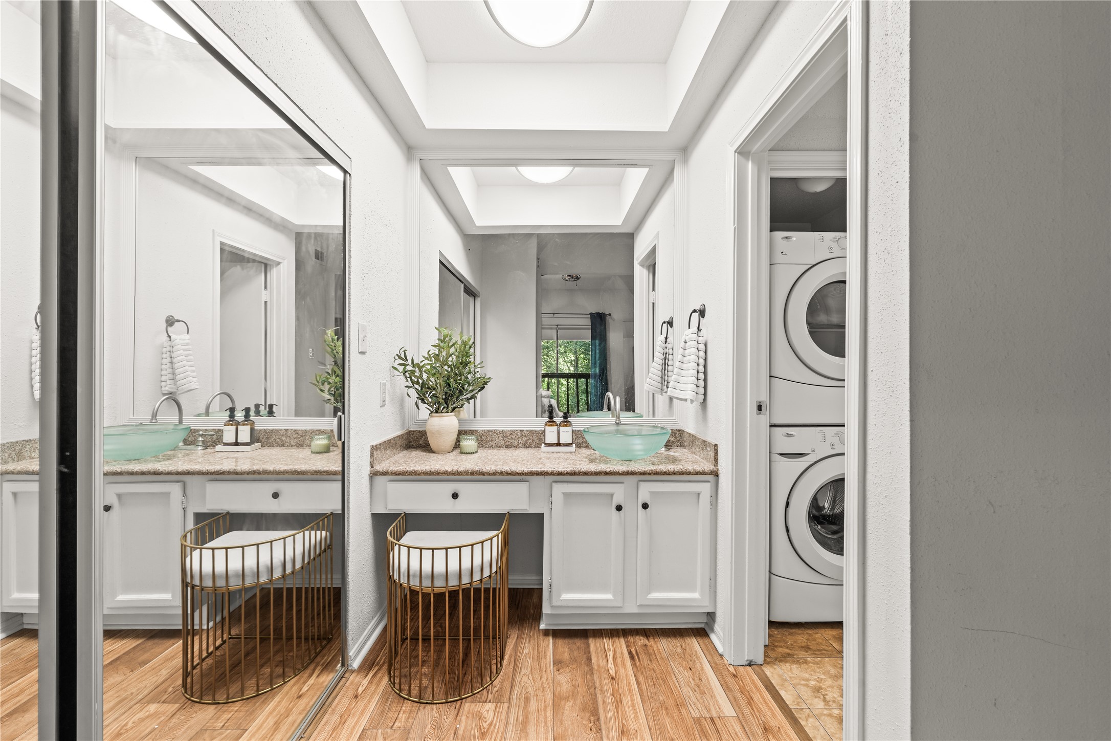 A dedicated vanity creates a convenient space to get ready each morning, while the full-size, in-unit washer and dryer make everyday living that much easier.