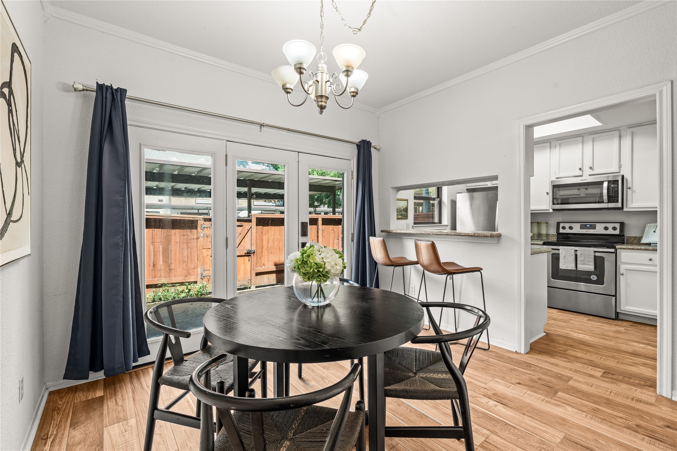 Whether you're hosting dinner or enjoying a quiet morning coffee, the dining area offers generous space with effortless access to the kitchen and patio.