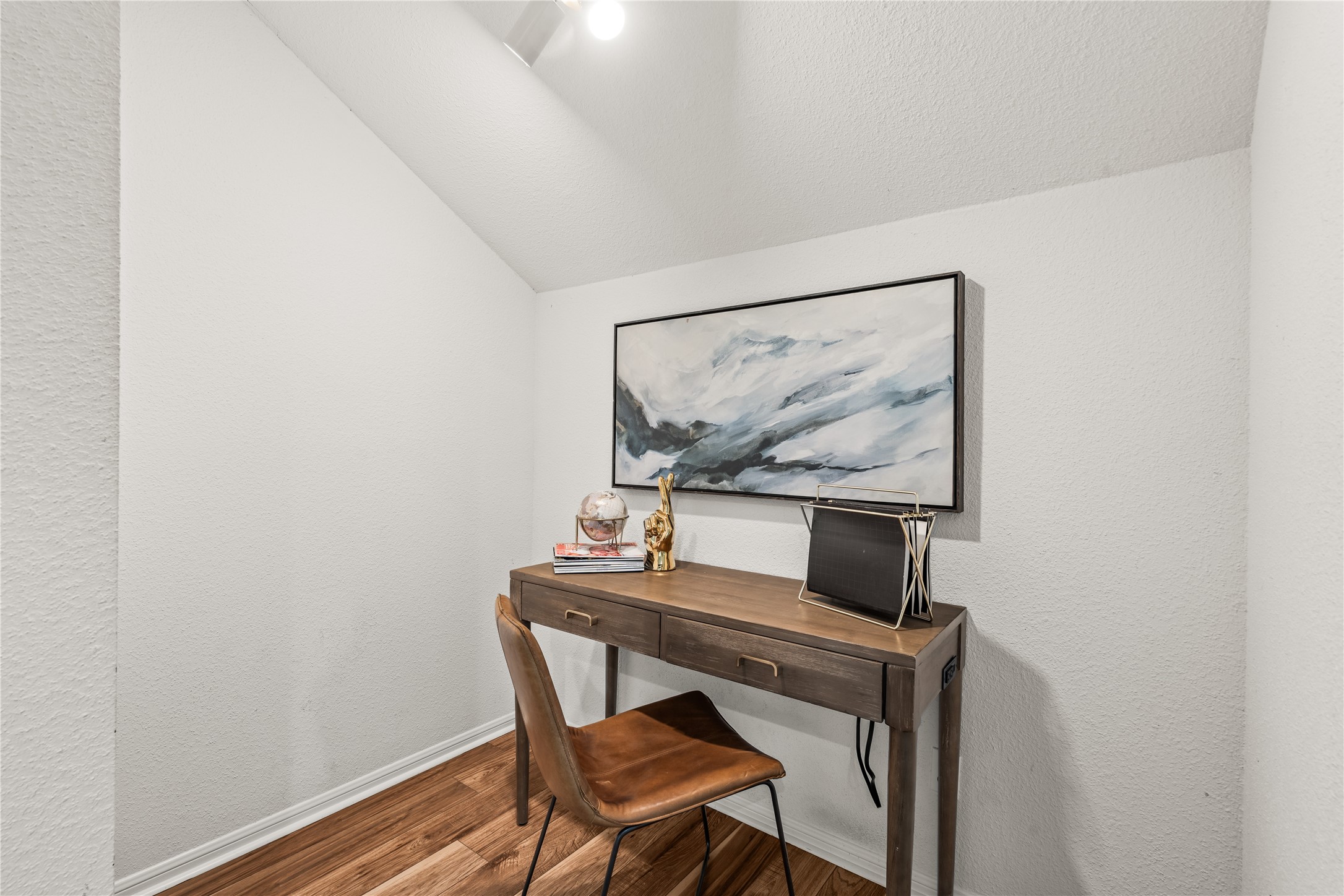 A dedicated office nook provides a quiet, tucked-away workspace without sacrificing space in the primary suite.