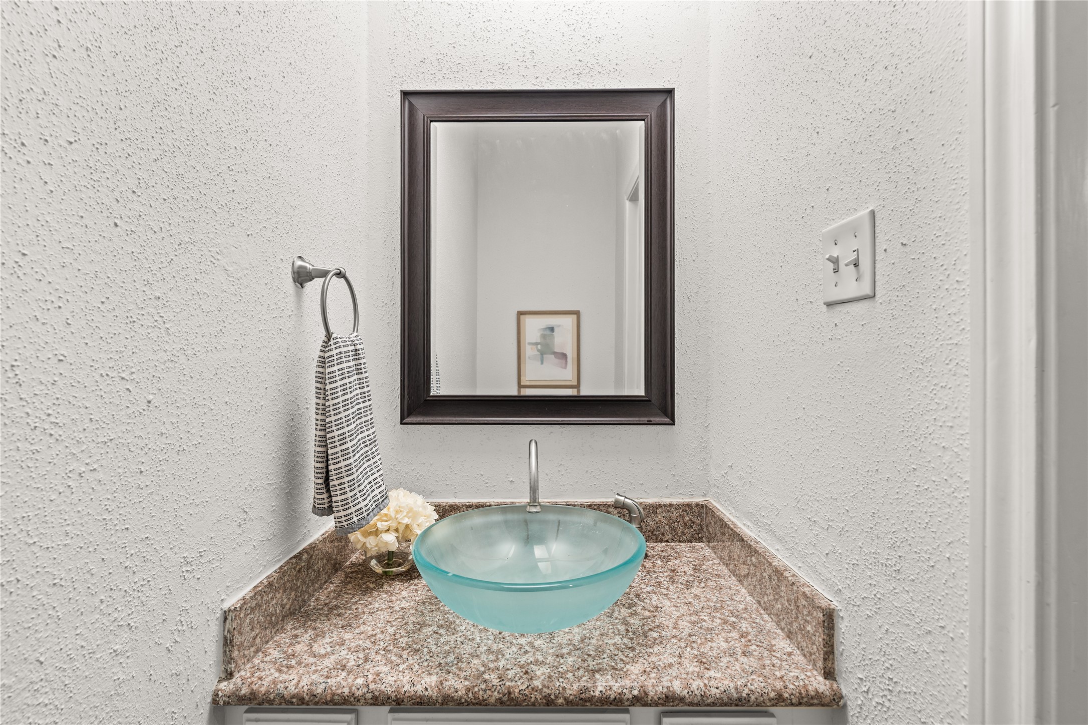 Thoughtfully positioned for guests, the powder bath adds everyday convenience to the main living level.
