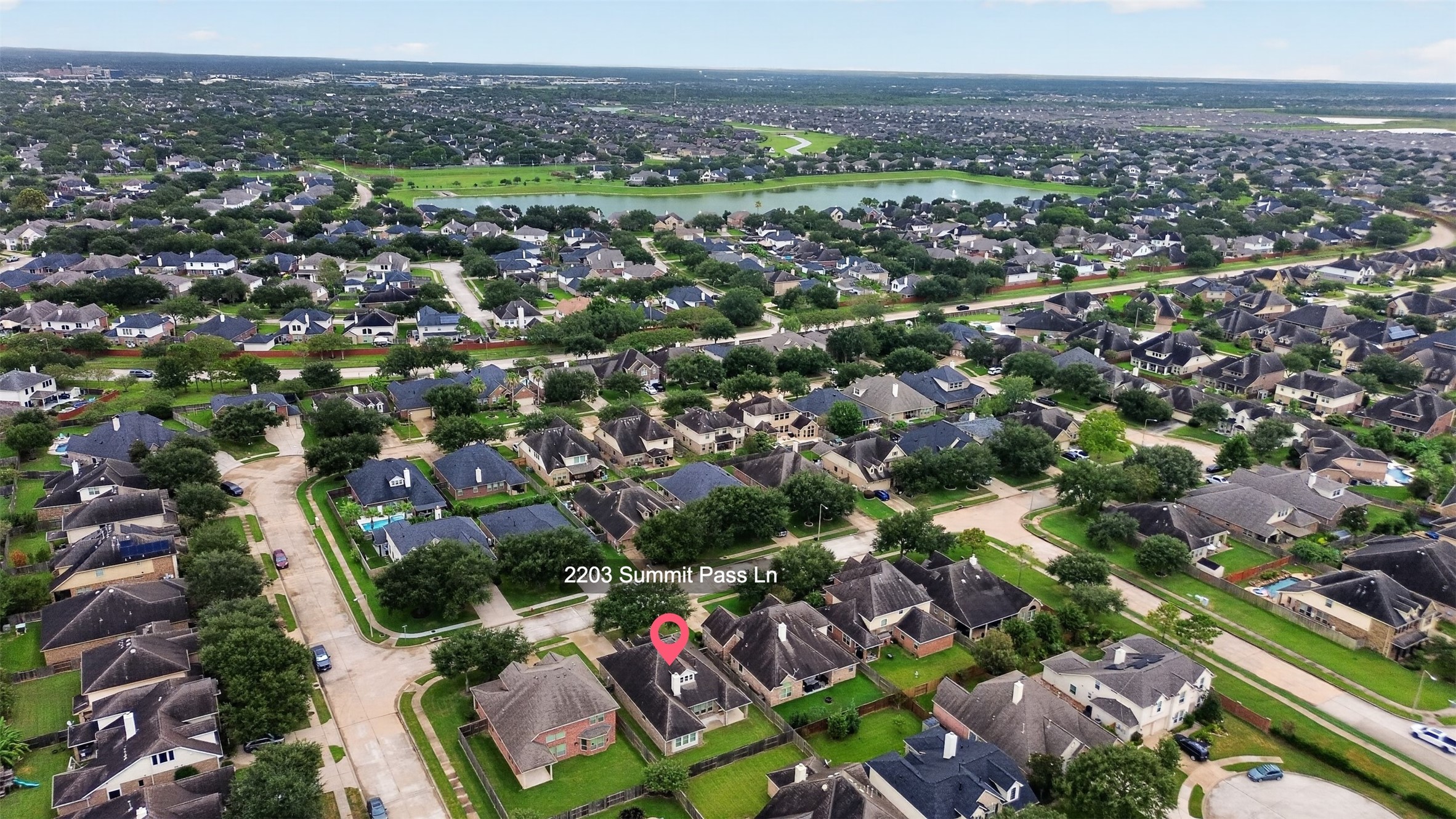 Aerial View of the home and nearby lake.