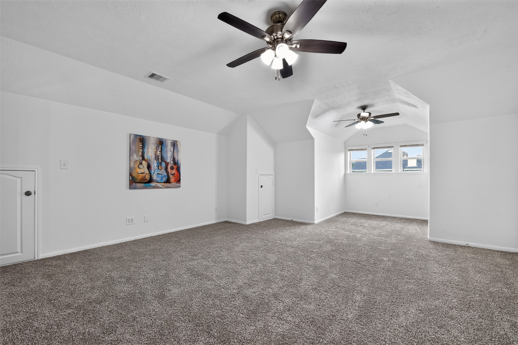 Family (or "game") room located upstairs with new carpet and ceiling fan.
